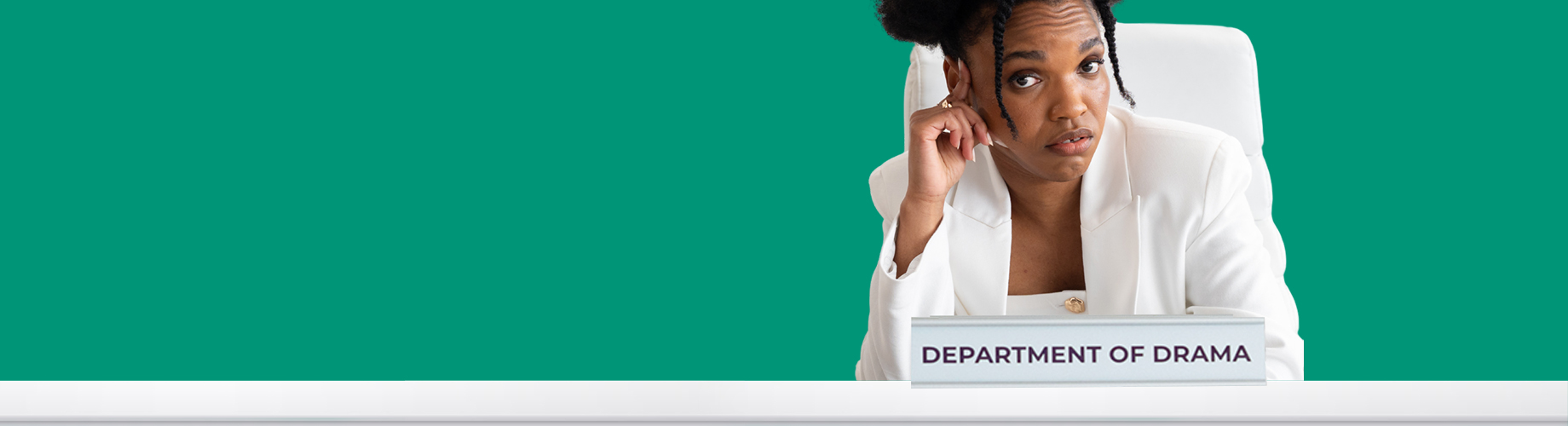 A woman in a white blazer sits at a desk labeled "Department of Drama," resting her head on one hand, against a plain green background.